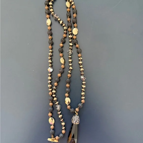 Long necklace with gold, black and brown
Accents - Picture 2 of 3